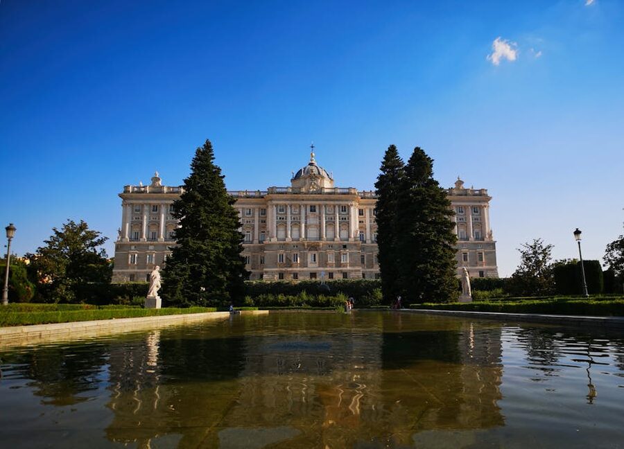 Royal Palace of Madrid with reflective pool in front
