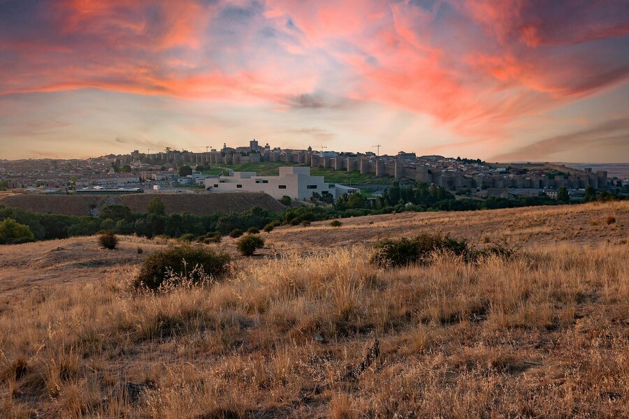 Avila ancient city walls at sunset Spain