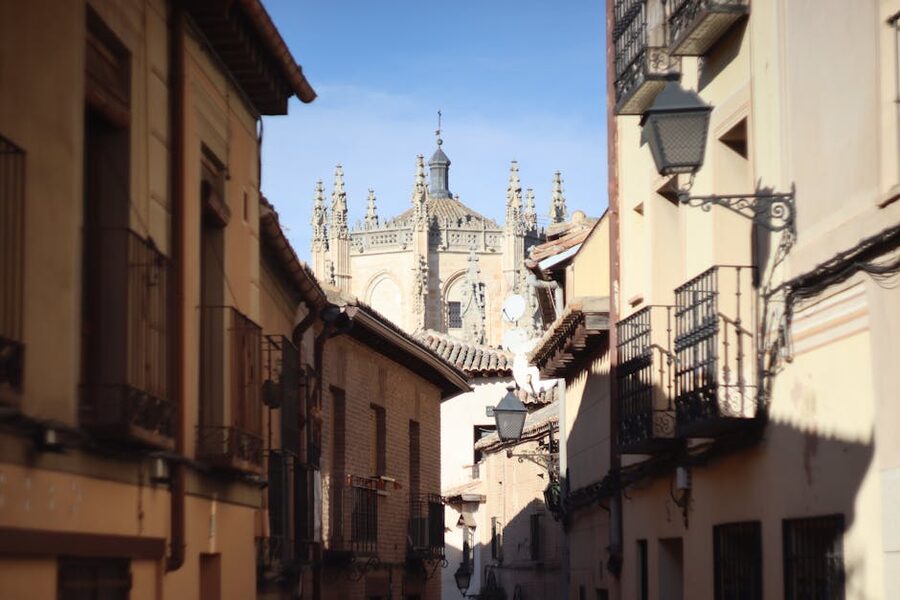 Toledo lane with cathedral spire visible above buildings