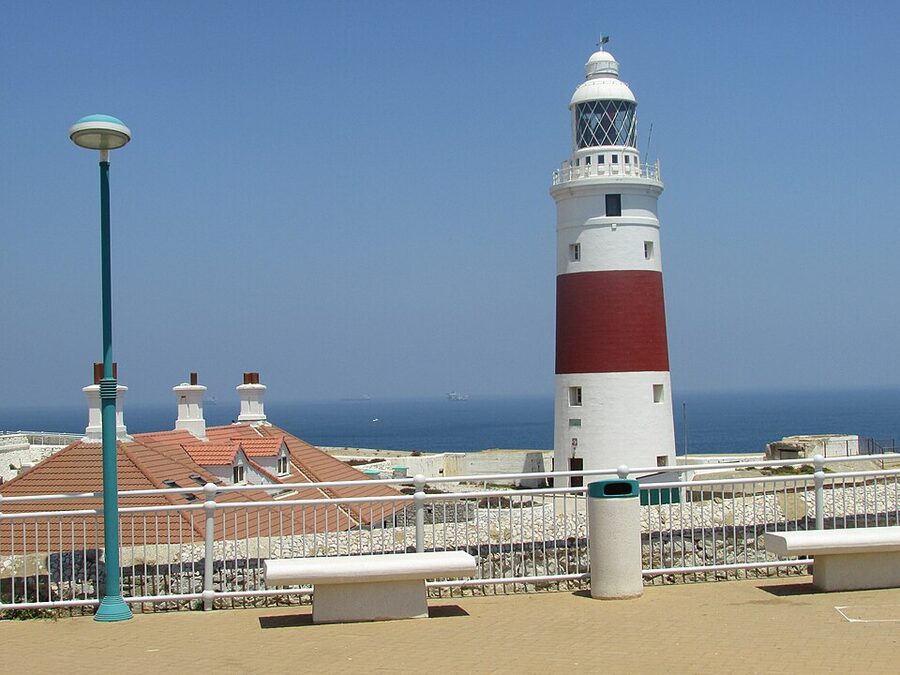 Europa Point Lighthouse at the southern tip of Gibraltar with the strait behind