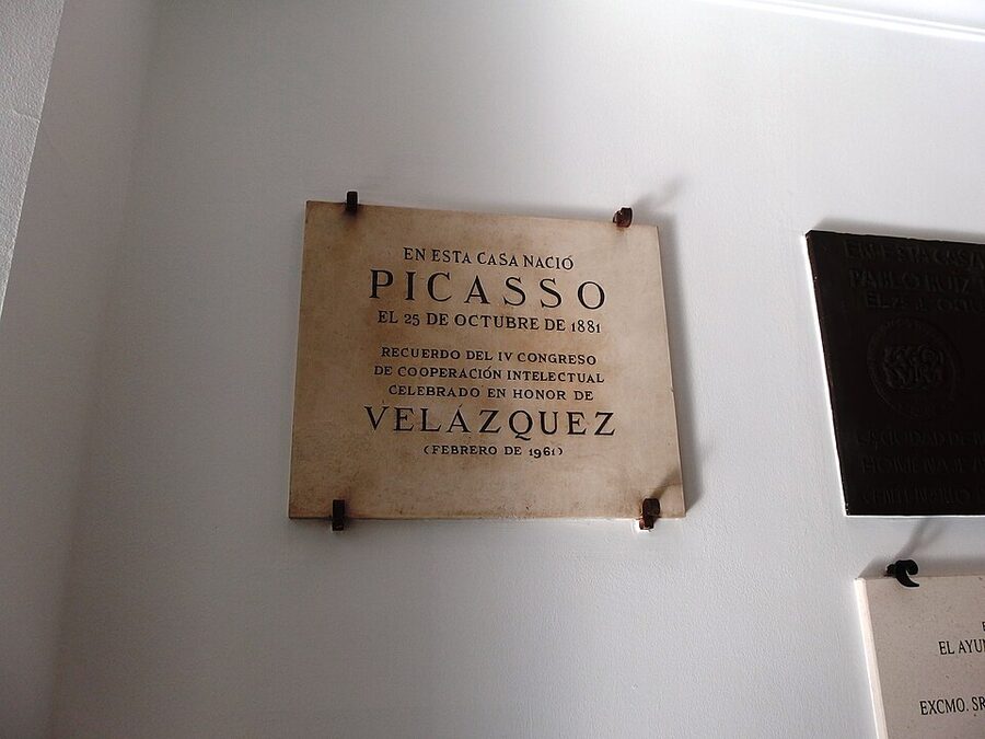 Casa Natal Picasso interior with paintings and family memorabilia