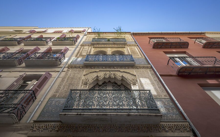 Malaga old city facades and narrow Andalusian street near the Picasso Museum