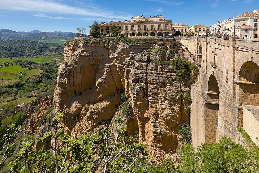 View from Puente Nuevo bridge in Ronda showing the Parador and gorge wall