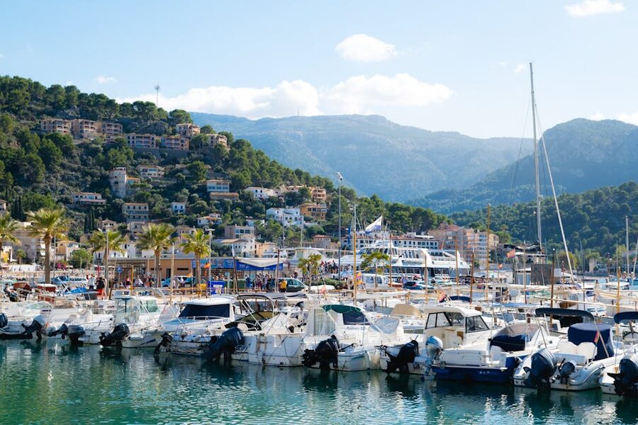 Port de Sóller marina with boats and hillside houses