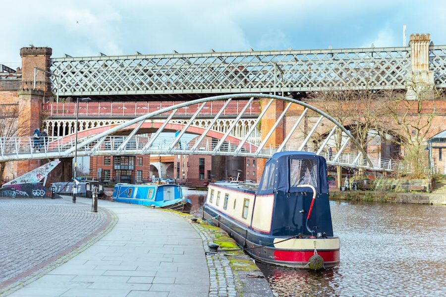 Canal boats and historic bridges in central Manchester