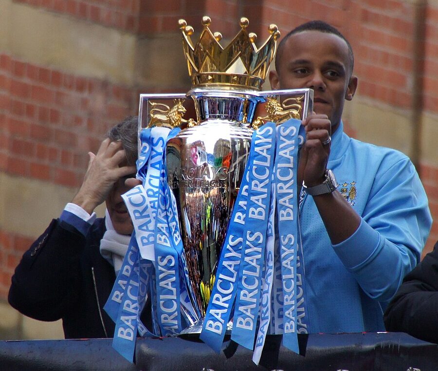 Vincent Kompany lifts the Premier League trophy in 2012
