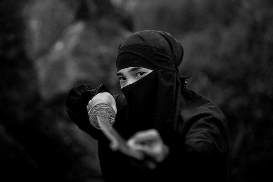 Dramatic masked samurai warrior with katana