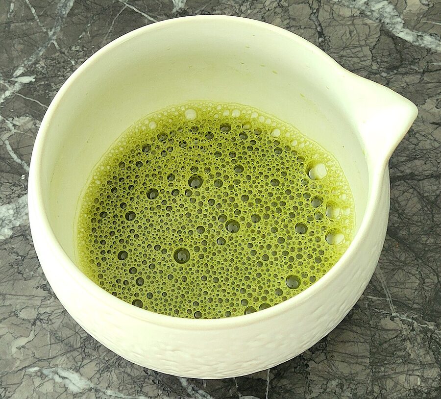 Prepared matcha green tea in a ceremonial bowl