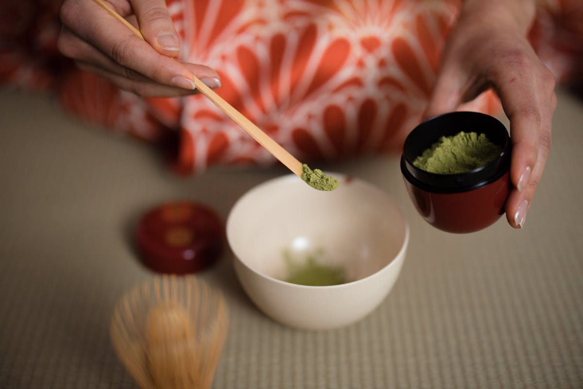 Close-up of matcha tea being prepared in a traditional Japanese ceremony