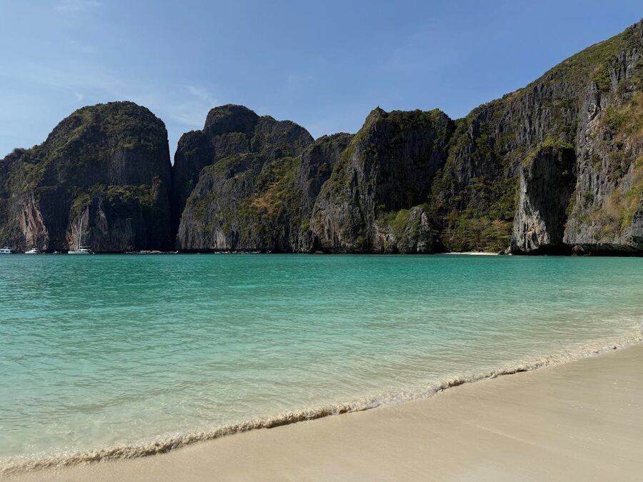 Maya Bay with turquoise water surrounded by towering limestone cliffs