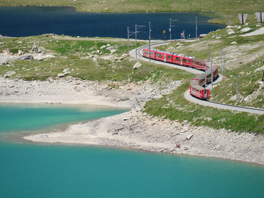 Bernina Express curving through Swiss Alps near Bernina Pass scenic