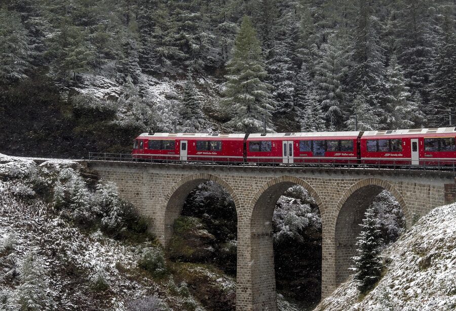 Bernina Express train in winter snowfall scenery