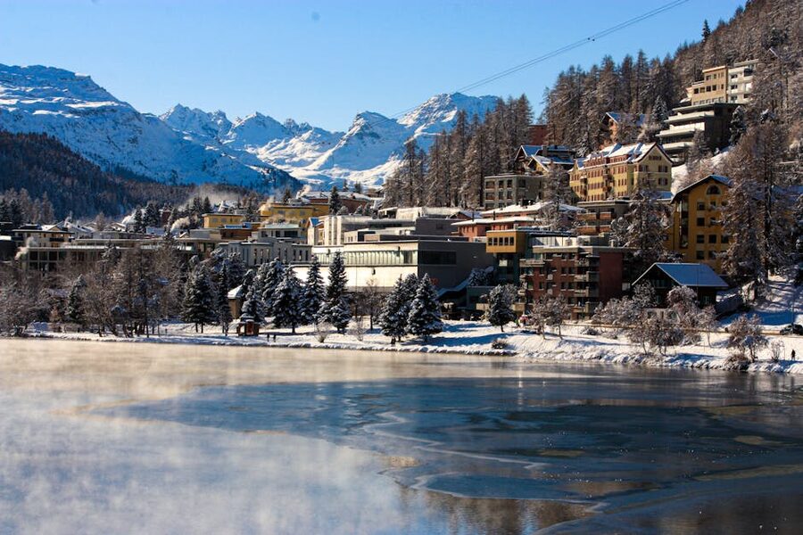 St Moritz in winter with frozen lake and snowy peaks Switzerland