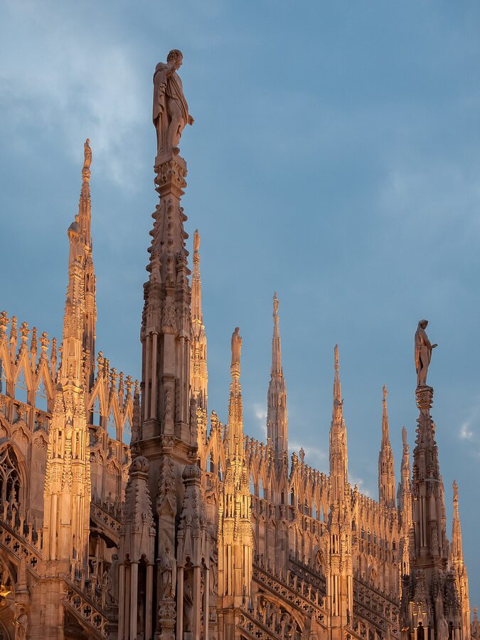 Milan Duomo central roof statues at sunset