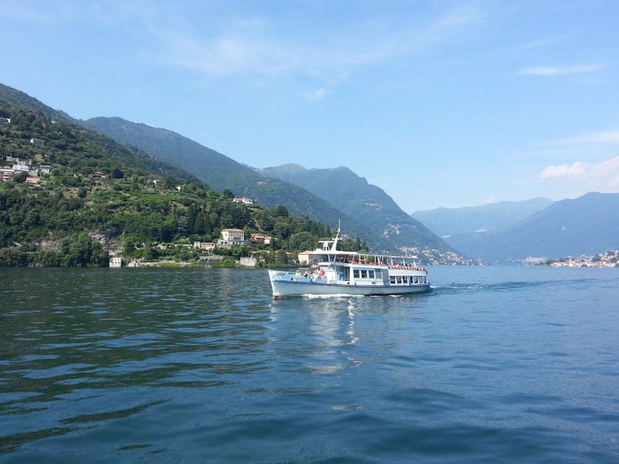 Public ferry cruising on Lake Como with green Lombardy hills behind