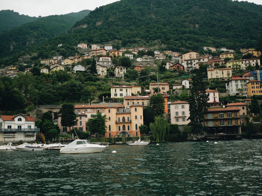 Charming village by Lake Como with boats docked at the waterfront