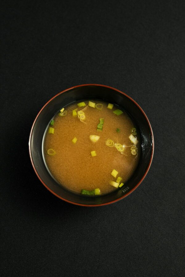 Bowl of homemade miso soup garnished with chopped green onions