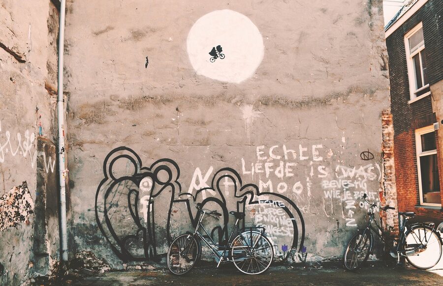 Banksy style street art with bicycles and stencil work