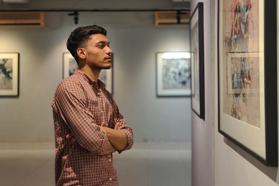 Visitor viewing artwork in modern gallery