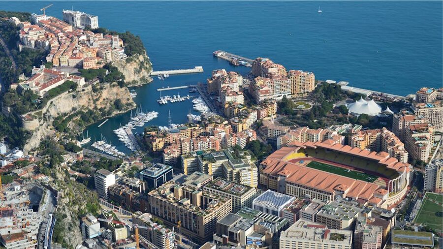 Aerial view of Monaco harbour and high-rise apartments along the Mediterranean coast