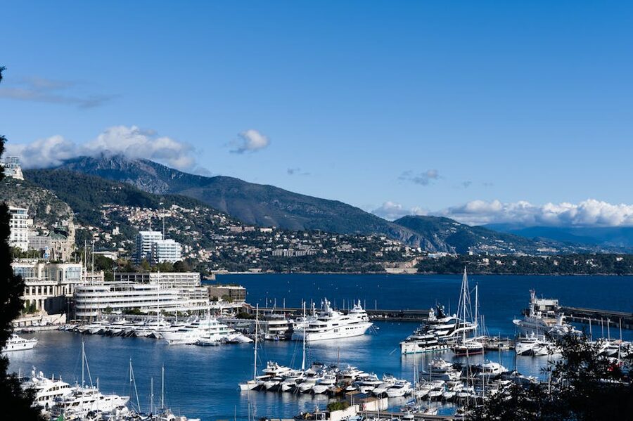 Monaco harbour with yachts and mountains rising behind