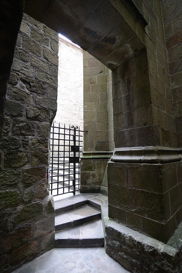 Vaulted hall inside Mont Saint Michel Abbey showing different architectural styles