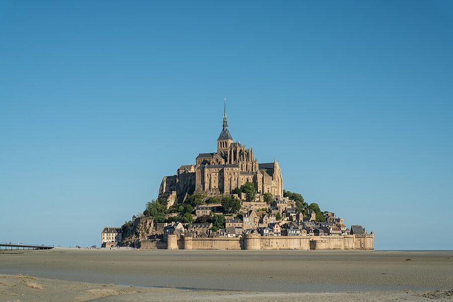 Mont Saint Michel during low tide in the morning showing exposed mudflats