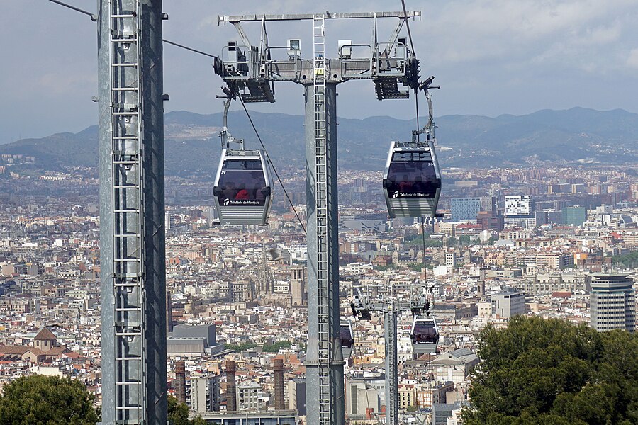 Yellow Montjuic cable car cabin approaching the upper station