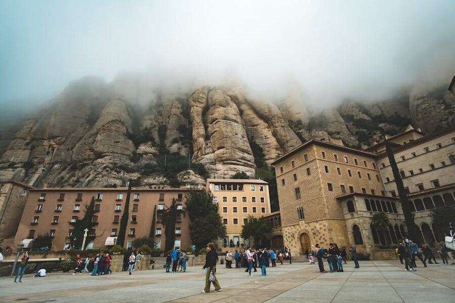 Montserrat monastery with fog drifting around the rock cliffs