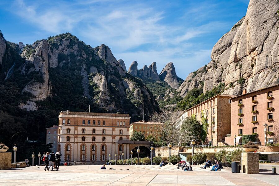 Montserrat monastery against vertical rock pinnacle backdrop