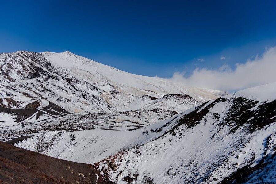 Steep barren snow-covered slopes of Mount Etna