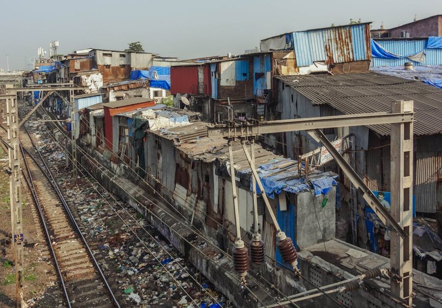 Dense community alongside railway tracks in Mumbai