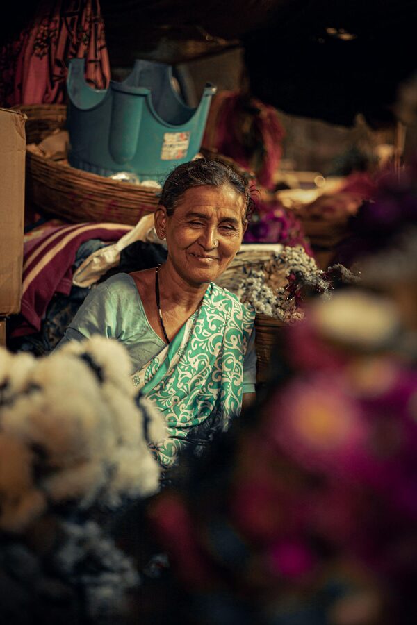 Smiling Mumbai flower seller at a local market