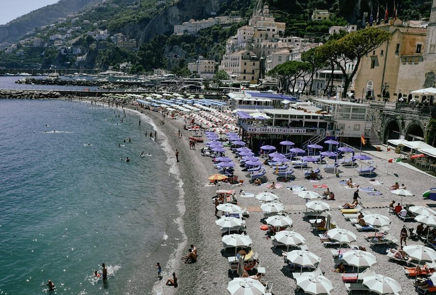 Pebble beach on the Amalfi Coast lined with umbrellas
