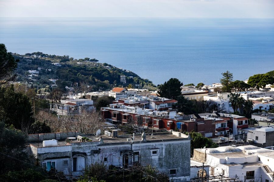 Aerial view of Capri coastline showing whitewashed buildings on the cliffs