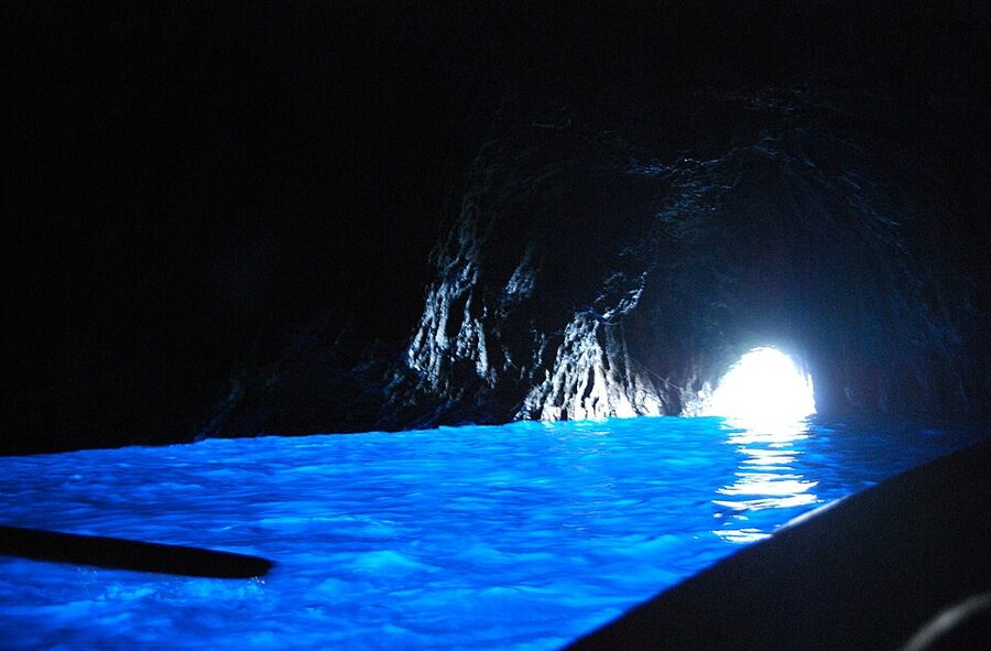 Inside the Blue Grotto on Capri showing the famous luminous blue water