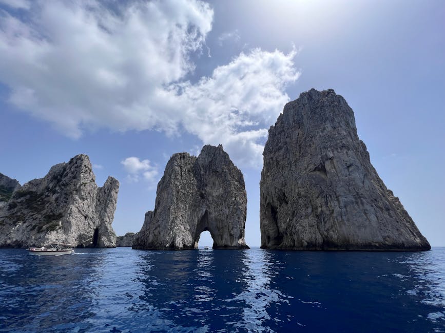 Faraglioni rock formations off Capri under a clear blue sky