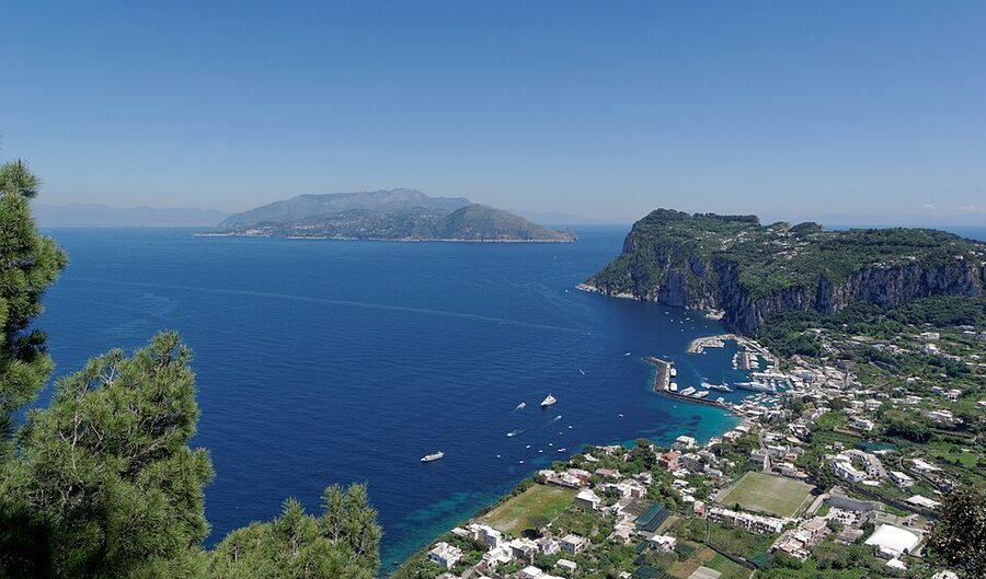 View of Capri harbour from above showing the layered town and sea