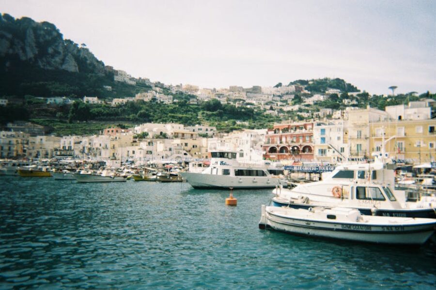 Boats docked at Marina Grande Capri with hills behind
