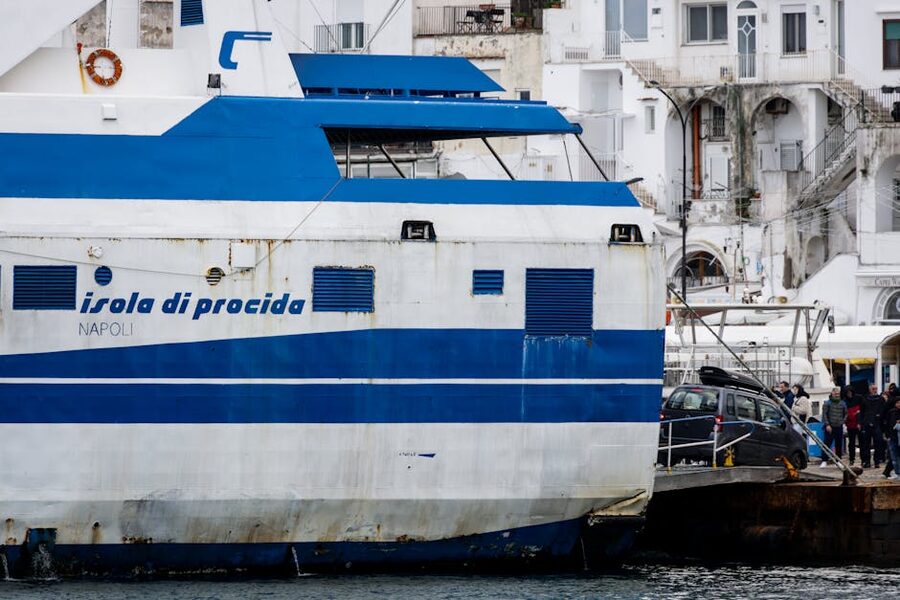 Ferry docked at Naples port with passengers boarding for an island crossing