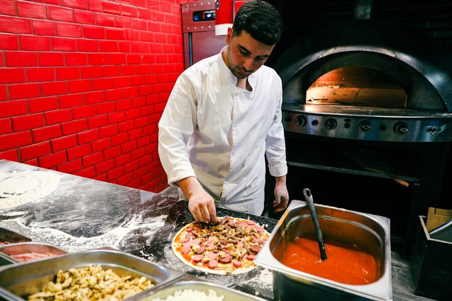 Pizza making class kitchen with brick oven