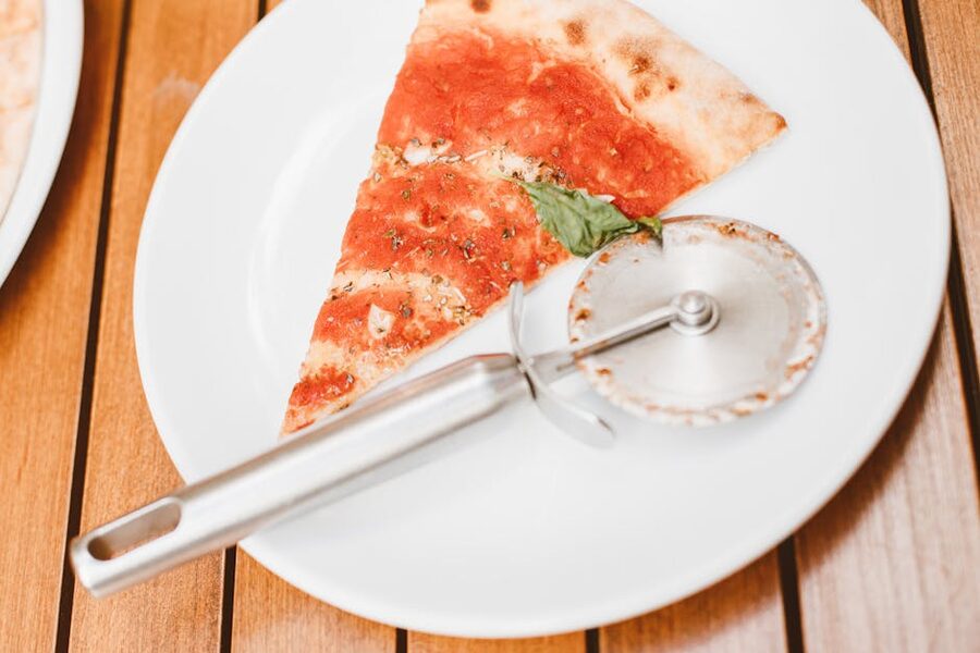 Margherita pizza slice with fresh basil