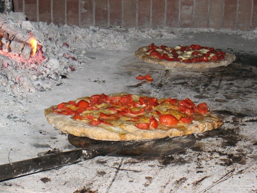 Wood burning pizza oven with flames
