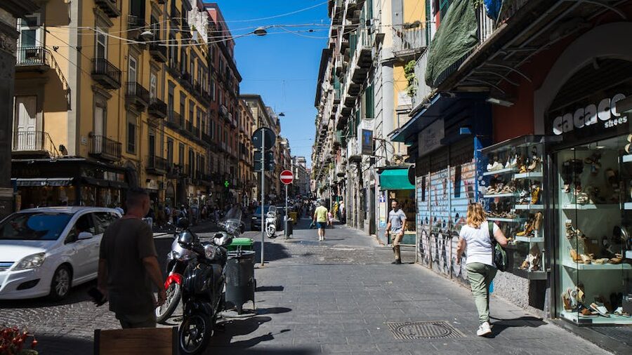 Naples street scene with shops and pedestrians