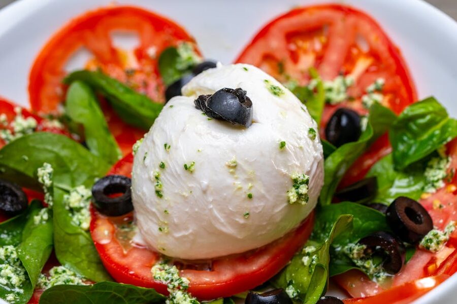 Caprese salad with fresh mozzarella tomatoes and basil