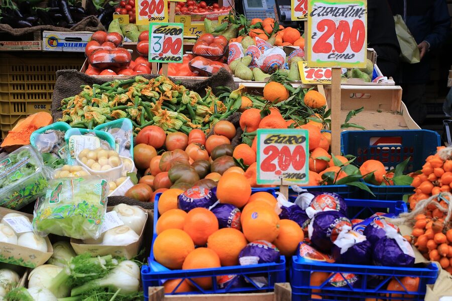 Naples market with fruits vegetables and price labels