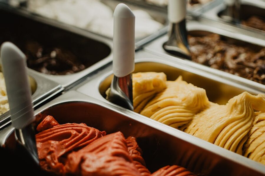 Italian gelato display in metal trays at shop