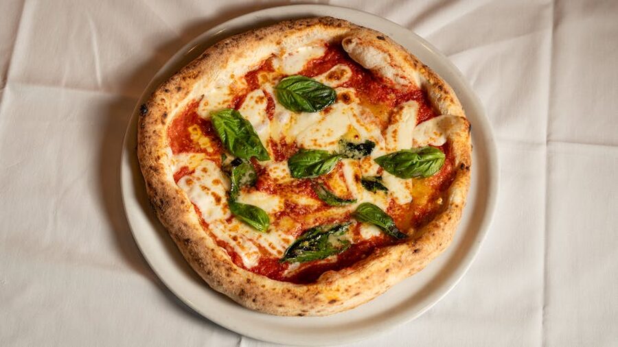 Classic Neapolitan Margherita pizza close-up with mozzarella and basil