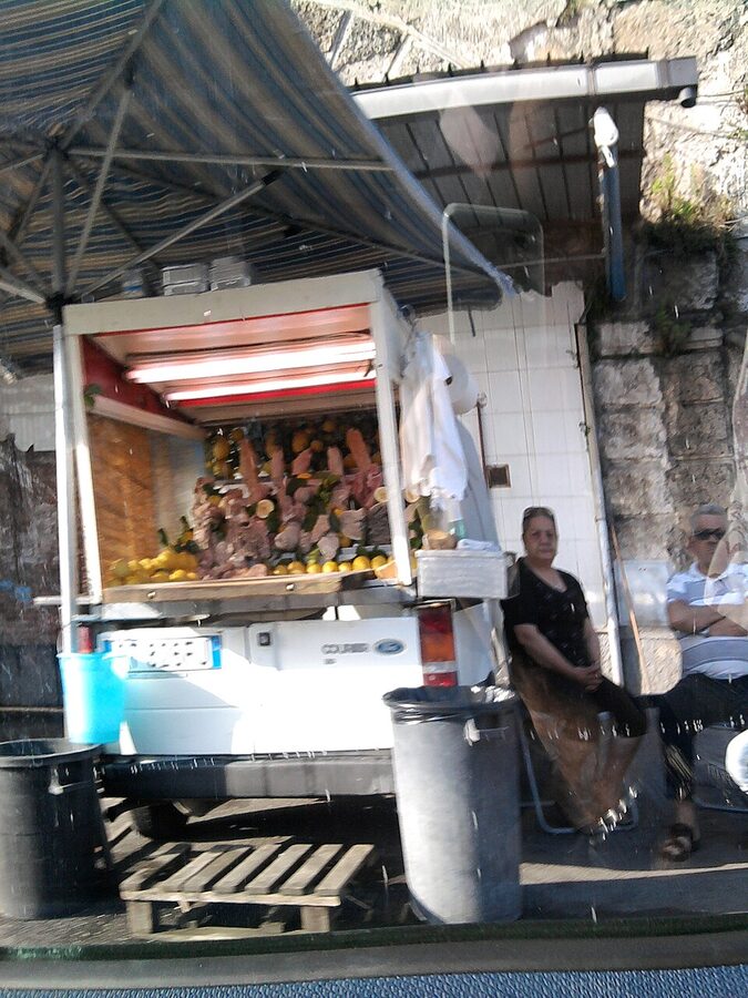 Pere e musso ape truck selling Naples offal street food
