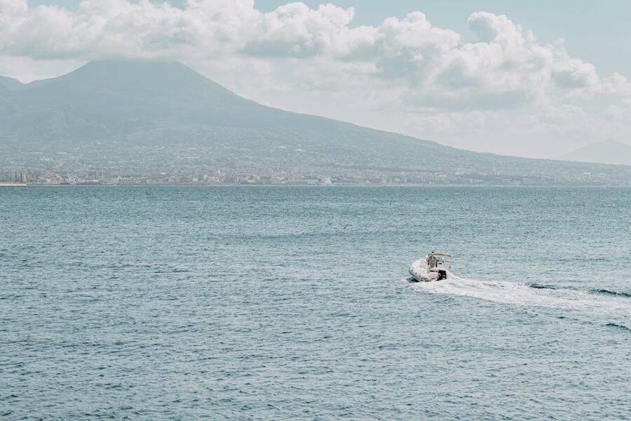 Bay of Naples with Mount Vesuvius behind a moving boat